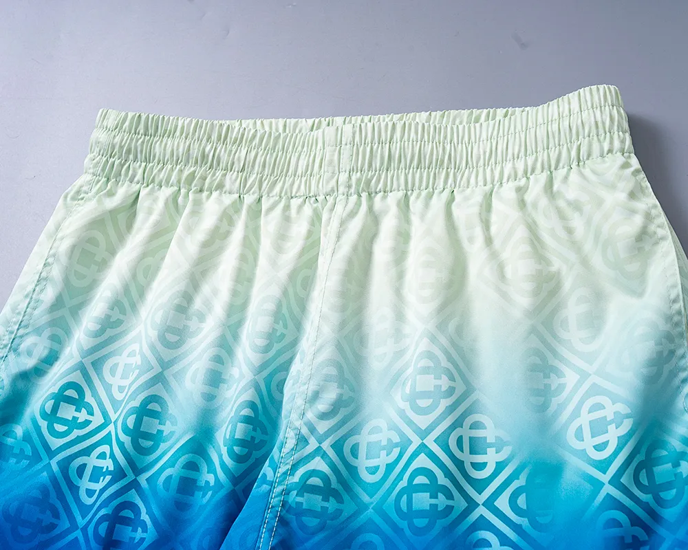 28138# 2026 Spring and Summer New Arrival Men's Short High Quality Swimming Beach Shorts. Official website synchronization. Original hardware. Rigorous workmanship. Side seams. Front and rear rails are double-line pressed. M-3XL. Gradual Color Change.